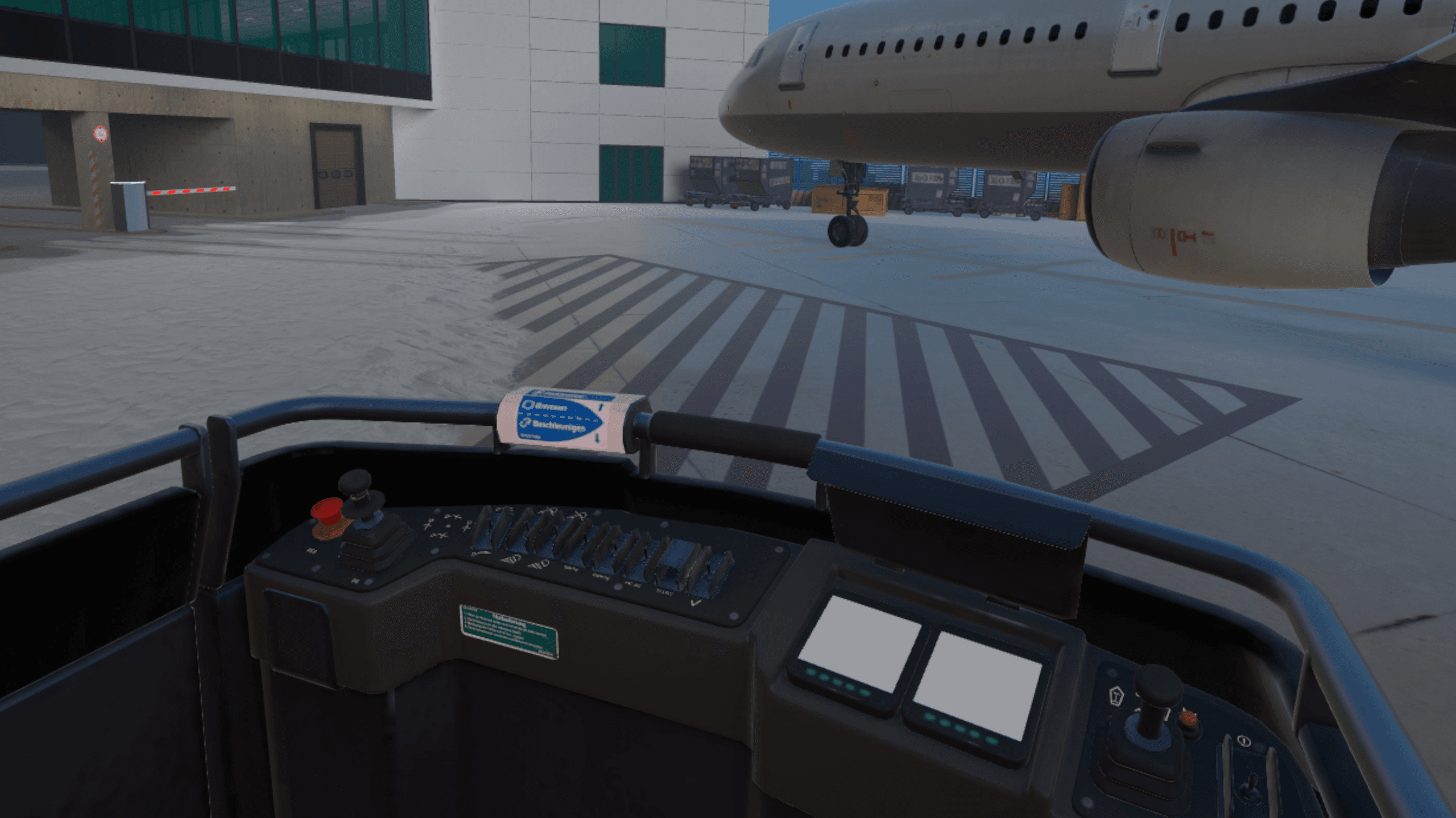 Blick aus dem Führerstand eines Push-back-Schleppers auf den Flugzeugbug und die Gepäckwagen auf der Position.