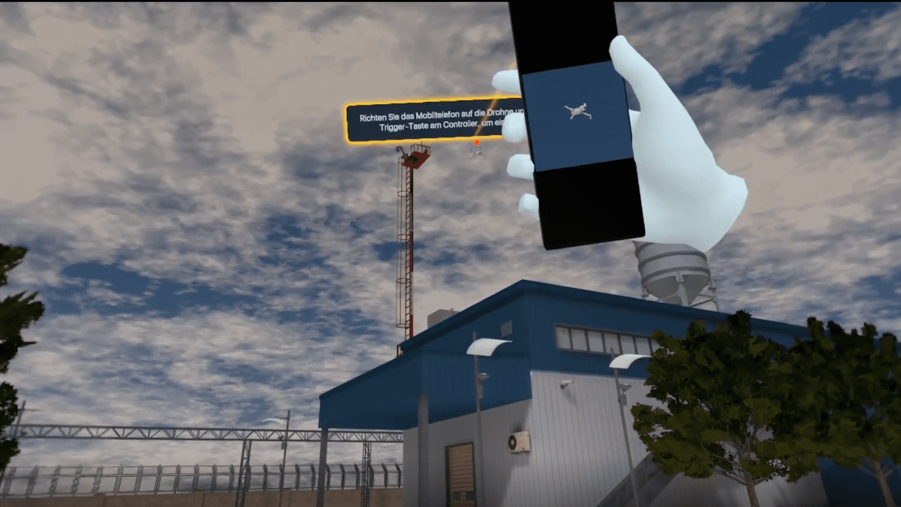 Una mano guantata tiene un telefono puntato verso un drone nel cielo, un reticolo di puntamento che lo traccia sullo schermo.