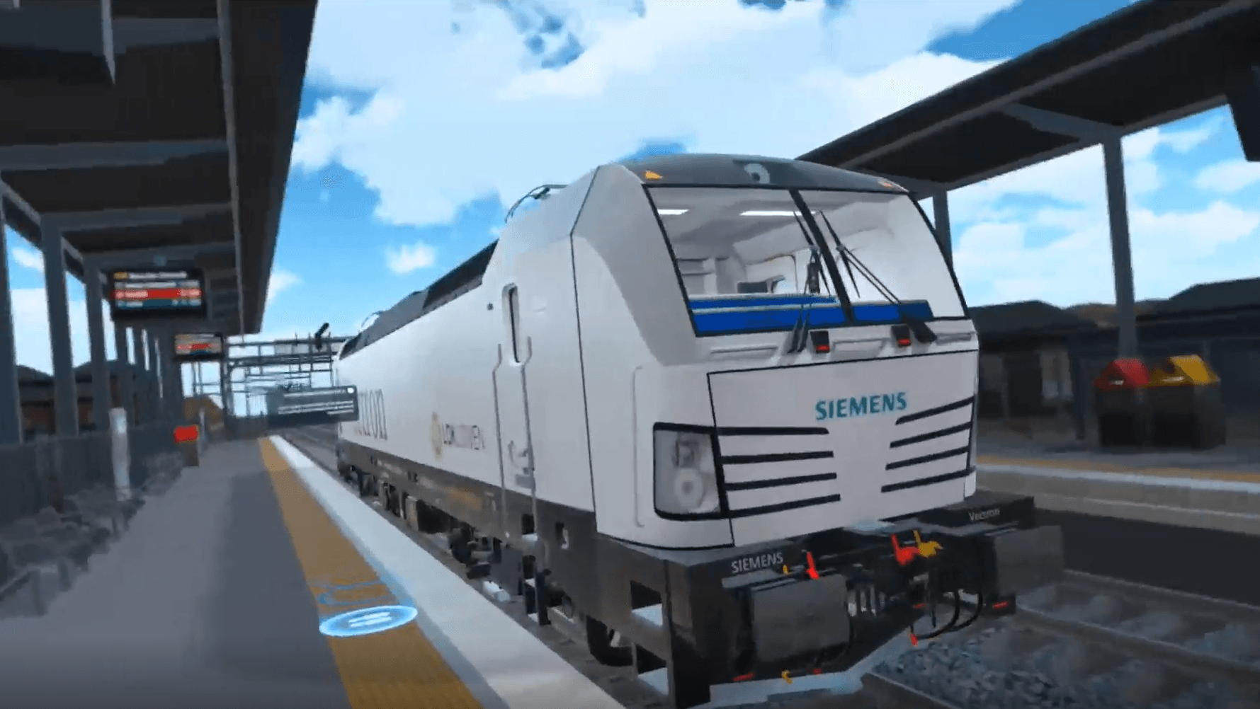 Egoperspektive im Führerstand auf das Bedienpanel, den Tacho und die Siemens-Steuerung, mit freier Strecke durch die Frontscheibe.