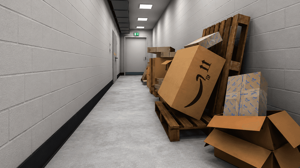 An escape route down a corridor is blocked by pallets and boxes stacked against the wall, an exit sign glowing at the far end.