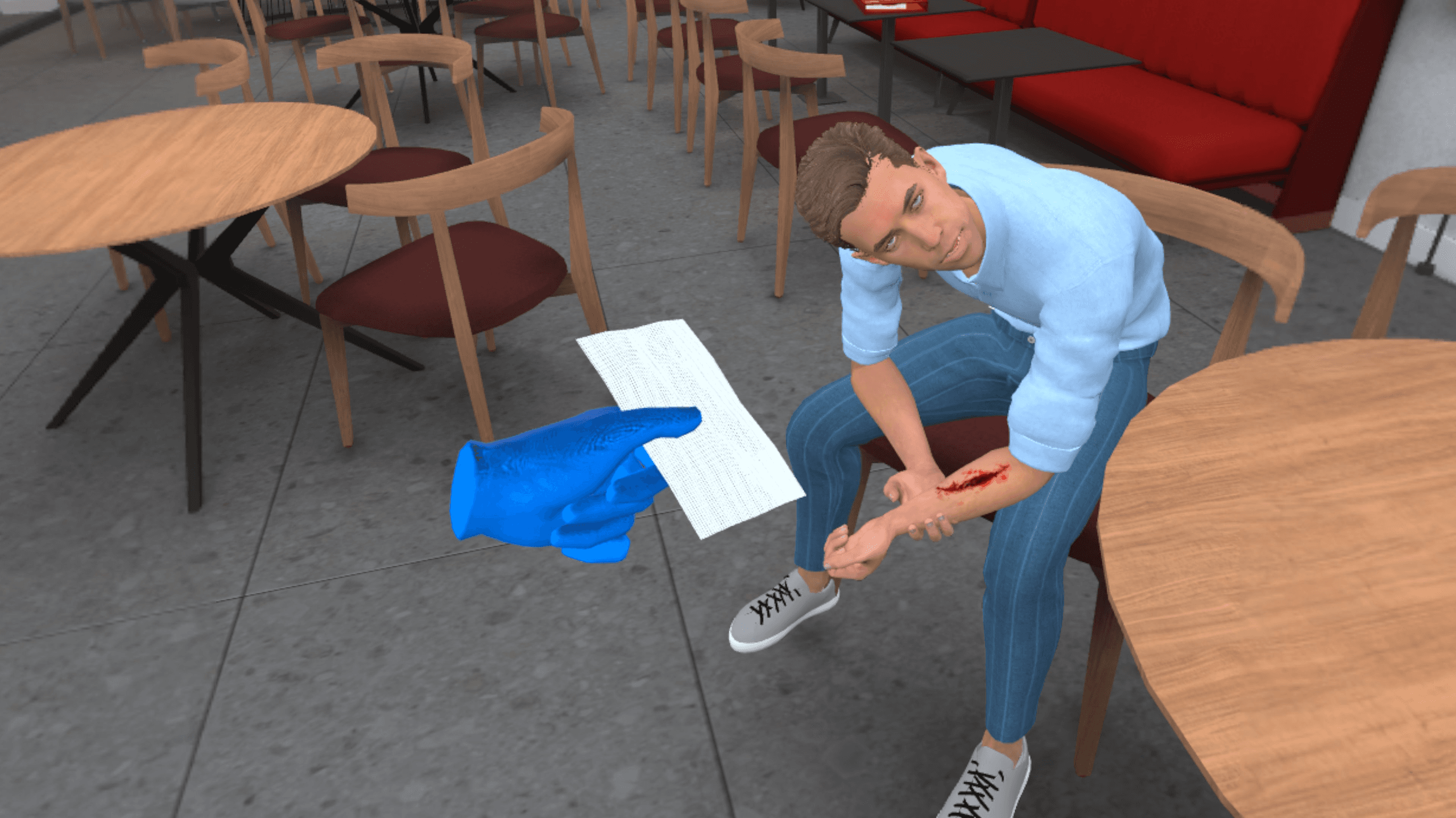 A gloved hand holds a bandage above a seated person's bleeding forearm at an outdoor café table.